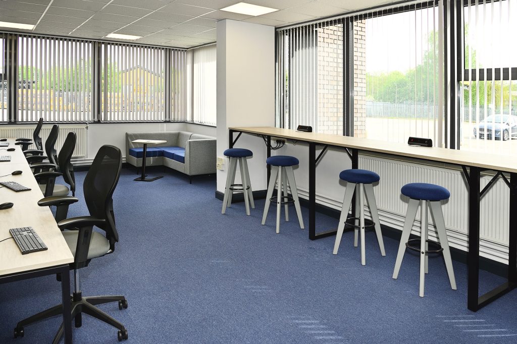 Collaboration breakout area with soft seating & high tables