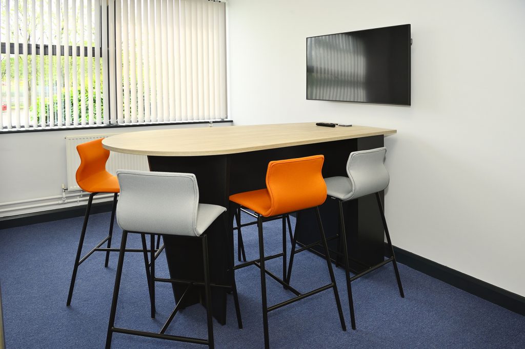 Informal meeting area with high office meeting table & stools